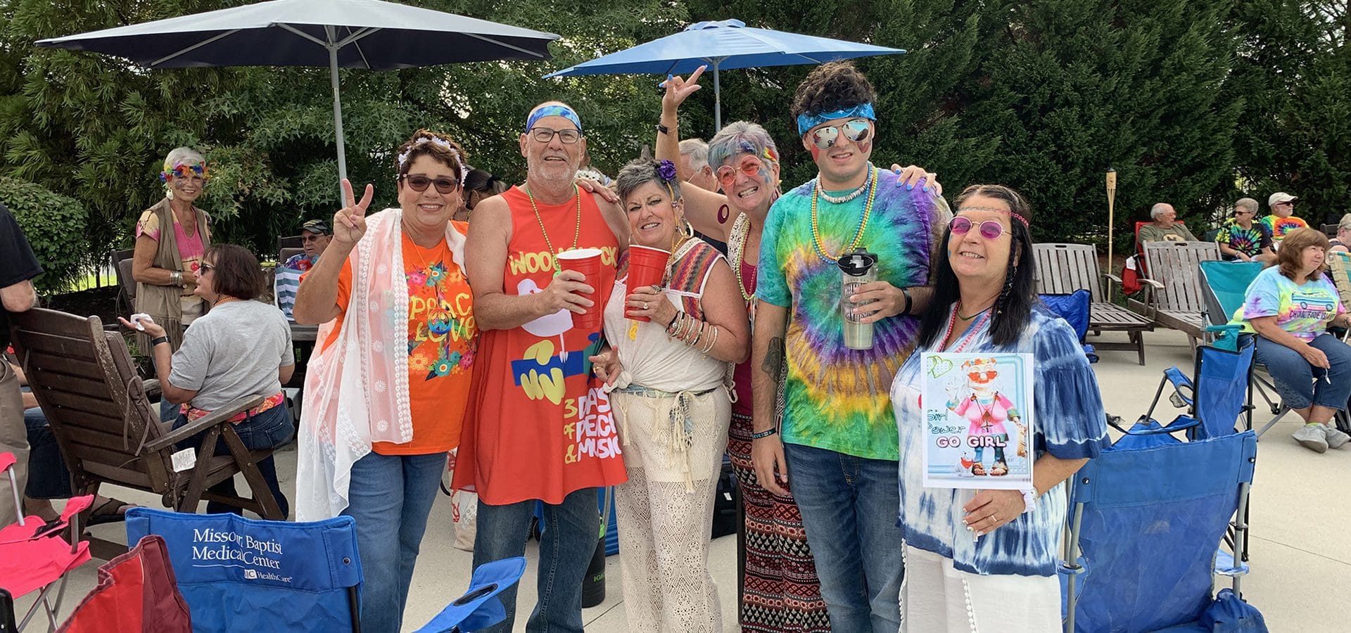 Nobles Pond residents dressed in Woodstock costumes at party